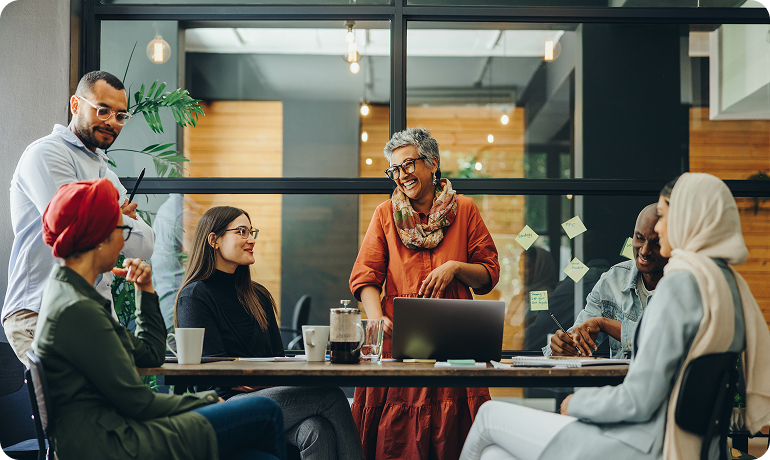 Offshore data analytics team collaborating on data project in meeting room