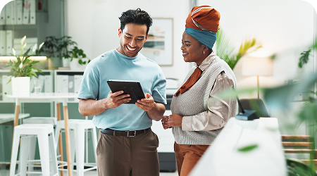 Two offshore analysts in offshore location discussing data analytics project