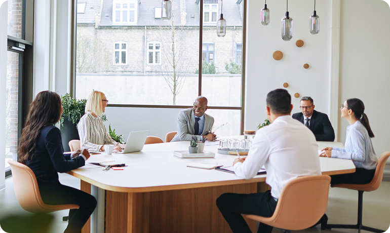 Business professionals discussing integrated offshore solutions to drive business growth