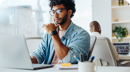 Marketing and creative professional working at desk on global campaigns and projects