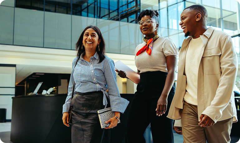 Offshore sales consultants walking and talking in modern office environment