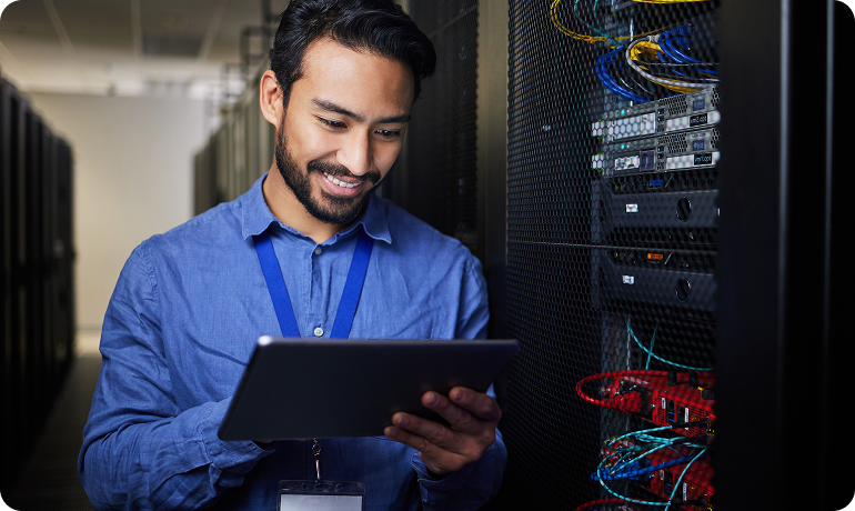 IT professional working on server hardware and it infrastructure in server room